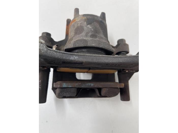 Front brake calliper, left from a Mitsubishi Space Star (A0) 1.2 12V 2020