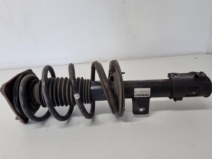 Fronts shock absorber, left from a Hyundai i30 (GDHB5) 1.4 16V 2014