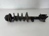 Fronts shock absorber, left from a Dacia Duster (HS) 1.6 16V LPG 2012