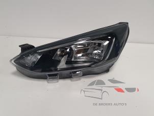Używane Reflektor lewy Ford Focus 4 1.0 EcoBoost 12V Hybrid 125 Cena € 300,00 Procedura marży oferowane przez De Broers Auto's