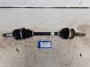 Front drive shaft, left from a Toyota Yaris III (P13), 2010 / 2020 1.5 16V Hybrid, Hatchback, Petrol, 1.497cc, 54kW, 1NZFXE, 2015-04 2019