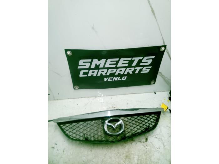 Używane Grill Mazda Premacy 1.8 16V Cena € 19,94 Procedura marży oferowane przez Smeets Autos Venlo