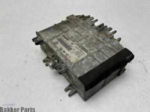 Engine management computer from a Volkswagen Polo III (6N1) 1.0i 50 1998