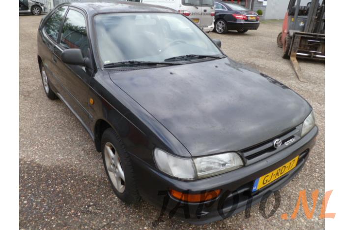 Toyota Corolla (E10) 1.6i 16V (salvage, year of construction 1993, colour Black) | ProxyParts.com